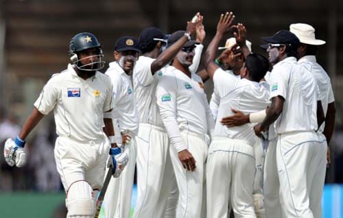 Sri Lankan cricketers celebrate the dismissal of Mohammad Yousuf during the fourth day of the first Test match between Pakistan and Sri Lanka at The Galle International Stadium in Galle on. (AFP Photo) Day 4: Pak vs SL, 1st Test