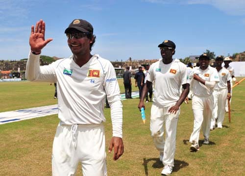 Kumar Sangakkara gestures following his team's victory as they walk off the pitch at the conclusion of the fourth day of the first Test match between Pakistan and Sri Lanka at The Galle International Stadium in Galle. (AFP Photo) Day 4: Pak vs SL, 1st Test