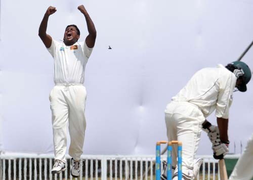 Sri Lankan cricketer Rangana Herath celebrates his team's victory at the conclusion of the fourth day of the first Test match between Pakistan and Sri Lanka at The Galle International Stadium in Galle. (AFP Photo) Day 4: Pak vs SL, 1st Test