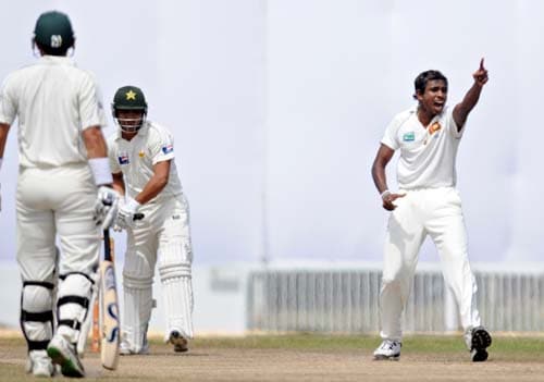 Thilan Thushara celebrates the dismissal of Kamran Akmal during the fourth day of the first Test match between Pakistan and Sri Lanka at The Galle International Stadium in Galle. (AFP Photo) Day 4: Pak vs SL, 1st Test