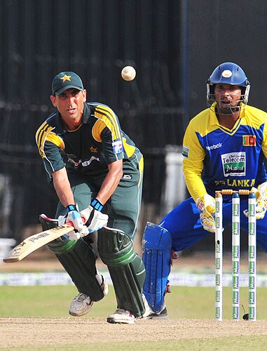Younus Khan plays a shot as Kumar Sangakkara looks on during the fifth and final One-Day International match between Sri Lanka and Pakistan at The R Premadasa Stadium in Colombo. (AFP Photo) Pak vs SL: 5th ODI