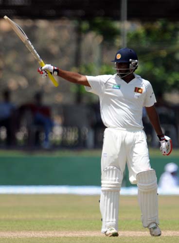 Tharanga Paranavitana raises his bat to the crowd after scoring a half-century during the first Test match between and Sri Lanka at The Galle International. (AFP Photo) Day 1: Pak vs SL, 1st Test