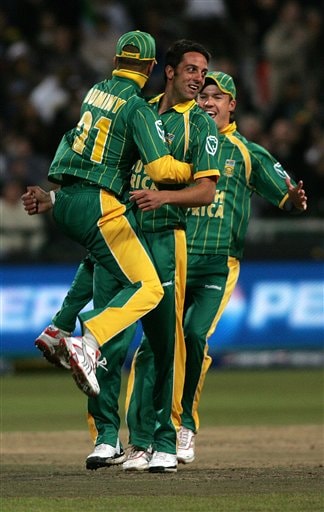 Africa's Johan Van Der Wath, middle, is congratulated by his teammates after dismissing Bangladesh's Shakib Al Hasan, not seen, during World Twenty 20 cricket Championships at Newlands in Cape Town, South Africa, Saturday Sept 15, 2007. South Africa vs Bangladesh