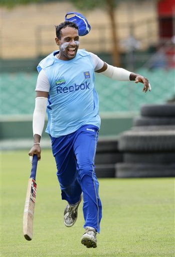 Thilan Samaraweera's cap blows off as he runs between the wickets, during a practice session at The Rangiri Dambulla International stadium in Dambulla. (AP Photo) Lanka in nets at Dambulla