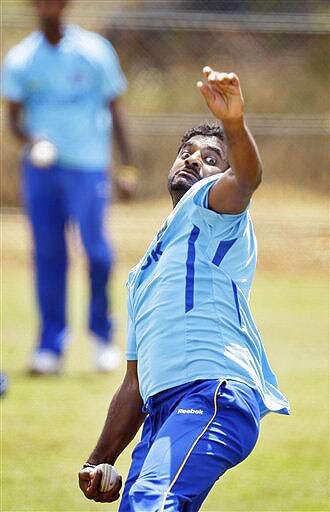 Muttiah Muralitharan bowls during a practice session at The Rangiri Dambulla International stadium in Dambulla. (AP Photo) Lanka in nets at Dambulla