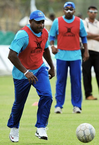 Sanath Jayasuriya and teammate Mahela Jayawardene play with a football during a practice session at The Rangiri Dambulla International stadium in Dambulla. (AFP Photo) Lanka in nets at Dambulla