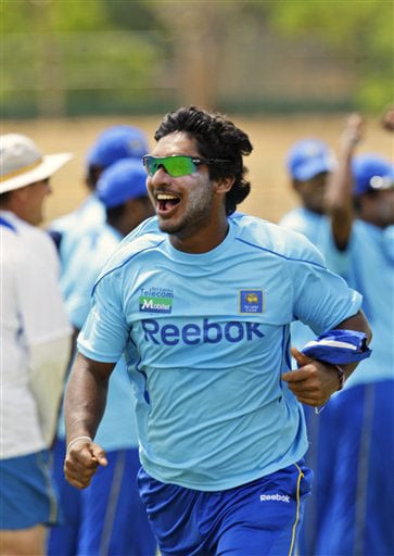 Kumar Sangakkara celebrates after a successful hit at the stumps, during a practice session at The Rangiri Dambulla International stadium in Dambulla. (AP Photo) Lanka in nets at Dambulla