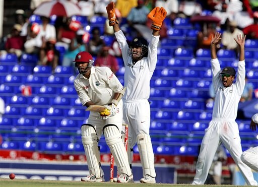 India's wicketkeeper Mahendra Dhoni, center, and captain Rahul Dravid, right, make an unsuccessfull LBW appeal on West Indies batsman Daren Ganga, left, on the first day of the third cricket test match at St. Kitts. Ind-WI 3rd Test Day 1