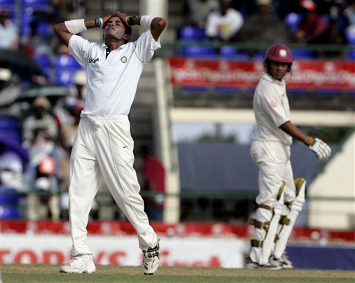 India's bowler S Sreesanth, left, reacts after missing the wicket of West Indies batsman Chris Gayle, not seen, on the first day of the third cricket test match St. Kitts. Ind-WI 3rd Test Day 1