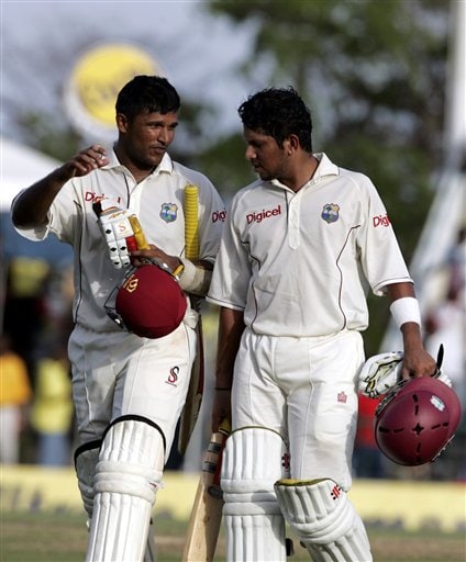 West Indies batsmen Daren Ganga, left, and Ramnaresh Sarwan, right, walk off the field on the first day of the third cricket test match against India at St. Kitts. Ind-WI 3rd Test Day 1