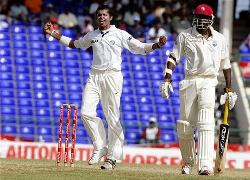 India's bowler Shanthakumaran Sreesanth, left, yells after West Indies batsman Chris Gayle, right, was caught off the bowling of Sreesanth for 3-for-1 in the second innings on the fourth day of the third cricket Test match at Warner Park in Basseterre, St Kitts, Sunday, June 25, 2006. (AP Photo/Lynne Sladky) Ind-WI 3rd Test Day 4