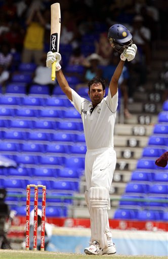 India's batsman VVS Laxman celebrates after scoring a century on the fourth day of the third cricket Test match against the West Indies at Warner Park in Basseterre, St Kitts, Sunday, June 25, 2006. (AP Photo/Lynne Sladky) Ind-WI 3rd Test Day 4