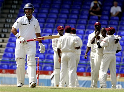 India's batsman Yuvraj Singh, left, walks off the field as the West Indies team celebrates when he was caught by wicketkeeper Denesh Ramdin for 159 for 4 on the fourth day of the third cricket Test match at Warner Park in Basseterre, St Kitts, Sunday, June 25, 2006. (AP Photo/Lynne Sladky) Ind-WI 3rd Test Day 4