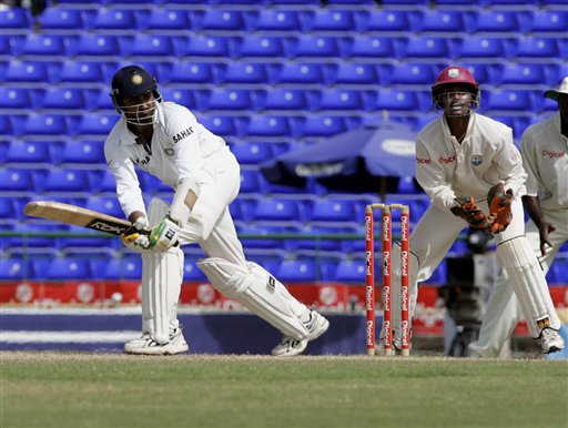 India's batsman Harbhajan Singh, left, bats as West Indies wicketkeeper Denesh Ramdin looks on during the fourth day of the third cricket Test match at Warner Park in Basseterre, St Kitts, Sunday, June 25, 2006. Singh had 38 runs not out in India's first innings. (AP Photo/Lynne Sladky) Ind-WI 3rd Test Day 4