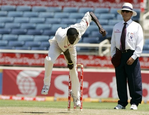 West Indies bowler Jerome Taylor, left, bowls to India during the fourth cricket Test at Kingston. Taylor had his first maiden five-wicket haul. Ind-WI 4th Test Day 1