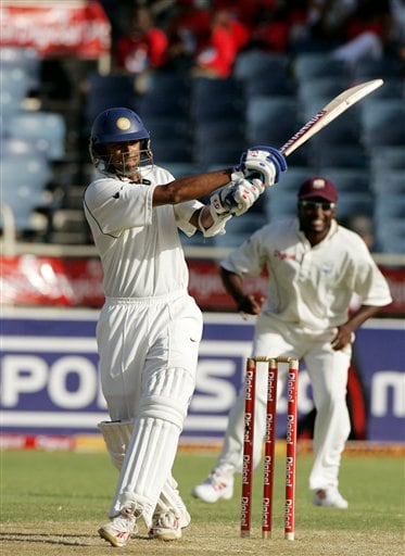 India's captain Rahul Dravid, left, hits a boundary as West Indies captain Brian Lara , right, looks on during the second day of the fourth cricket Test at Kingston Ind-WI 4th Test Day 2