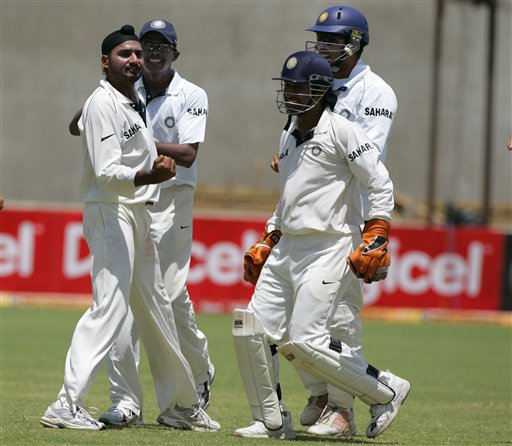 India's spin bowler Harbhajan Singh, left front, celebrates after taking the final West Indies wicket on the second day of the fourth cricket Test at Kingston. Ind-WI 4th Test Day 2