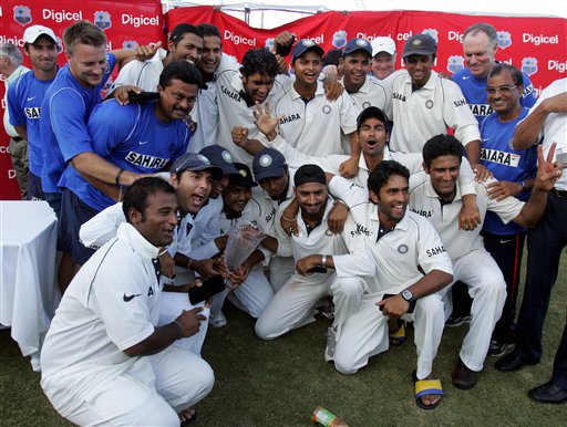 India's cricket team poses with the trophy after defeating the West Indies on the third day of the fourth and final cricket test match at Sabina Park in Kingston, Jamaica Sunday, July 2, 2006. India won by 49 runs, and won the series 1-0. Ind-WI 4th Test Day 3