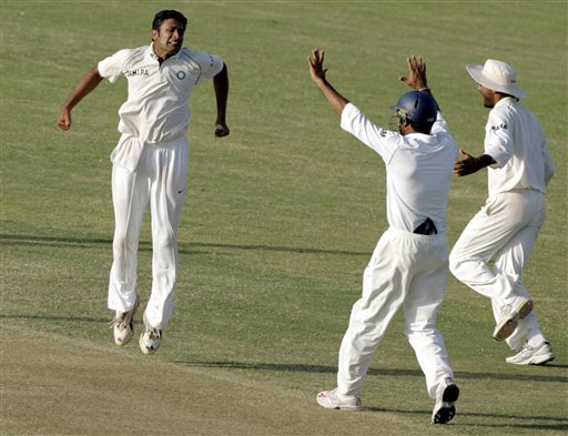 India's bowler Anil Kumble, center, jumps into the air as he celebrates with VVS Laxman, center, and Harbhajan singh, right, after defeating the West Indies on the third day of the fourth and final cricket test match at Sabina Park in Kingston, Jamaica Sunday, July 2, 2006. Kumble had six wickets as India won the match by 49 runs, and the series 1-0. Ind-WI 4th Test Day 3