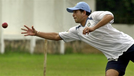 Sachin Tendulkar dives to catch a ball during a training camp as the Indian cricket team prepares for the tri-nation series in Malaysia. India gears up for DLF Cup