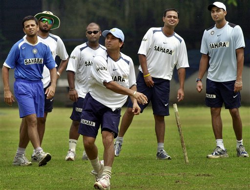 Sachin Tendulkar, front, throws a ball as teammates, from left to right, Captain Rahul Dravid, Harbhajan Singh, Ramesh Powar, Dinesh Mongia, and VRV Singh, watch as the Indian team prepares for the tri-nation series in Malaysia. India gears up for DLF Cup