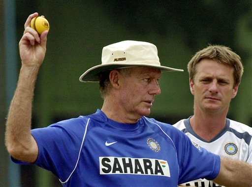 Indian Coach Greg Chappell, left, prepares to throw a ball as team physiotherapist John Gloster looks on during the training camp as the Indian team prepares for the tri-nation series in Malaysia. India gears up for DLF Cup