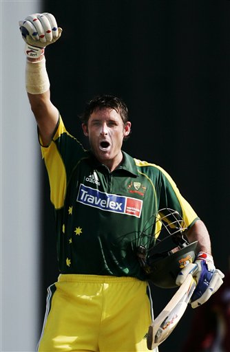 Australian batsman Micahel Hussey celebrates making 100 runs against the West Indies in their tri-series match in Kuala Lumpur on Monday. DLF Cup Round 2 WI-Aus