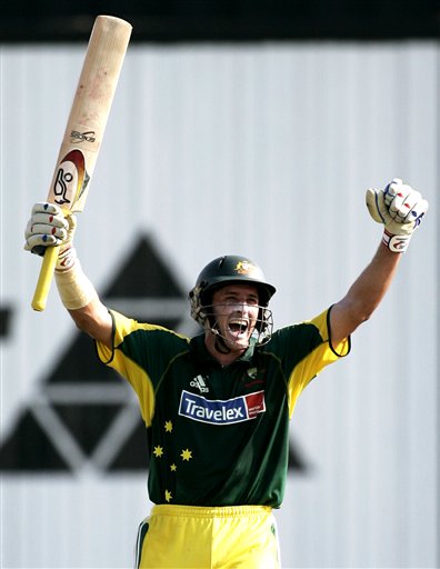 Australian batsman Micahel Hussey celebrates making 100 runs against the West Indies in their tri-series match in Kuala Lumpur on Monday. DLF Cup Round 2 WI-Aus