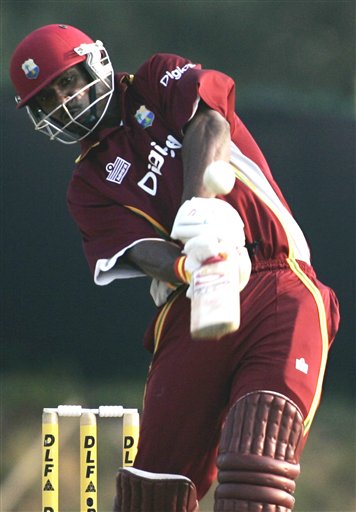 West Indies' batsman Runako Morton lifts a shot into the air off the bowling of India's Manuf Patel in their tri-series cricket match in Kuala Lumpur on Wednesday. DLF Cup Rd 2 Ind-WI