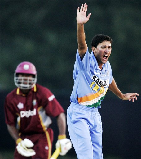 India's Ajit Agakarkar, right, appeals for a lbw and is awarded the wicket of West Indies' batsman Dwayne Smith, left, for 12 runs in their tri-series cricket match in Kuala Lumpur on Wednesday. DLF Cup Rd 2 Ind-WI