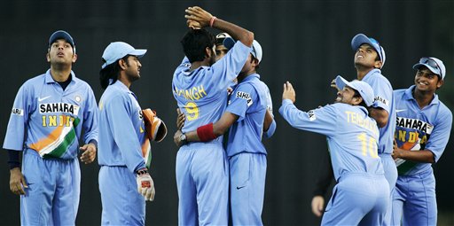 Indian teammates, from left, Yuvraj Singh, Mahendra Singh Dhoni, Rudra Pratap Singh, Harghajan Singh, Shanthakumaran Sreesanth, Sacin Tendulkar, Rahul Dravid, and Suresh Raina, celebrate while keeping an eye out for a falling cricket ball after R P Singh dismissed West Indies' batsman Chris Gayle for 1 run in their tri-series cricket match in Kuala Lumpur on Wednesday. DLF Cup Rd 2 Ind-WI