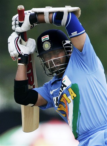 Indian batsman Sachin Tendulkar lifts his bat and turns to watch a fielding play by the West Indies in their tri-series cricket match in Kuala Lumpur on Wednesday. DLF Cup Rd 2 Ind-WI