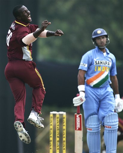West Indies' Dwayne Smith, left, cheerfully appeals for a caught behind on India's batsman Yuvraj Singh for no score in their tri-series match in Kuala Lumpur on Wednesday. DLF Cup Rd 2 Ind-WI