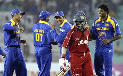 Elton Chigumbura of Zimbabwe walks out to pavilion as Sri Lankan cricketers celebrate his dismissal during ICC Champions Trophy's qualifying match at Ahmedabad on Tuesday. ICC CT Sri Lanka-Zimbabwe