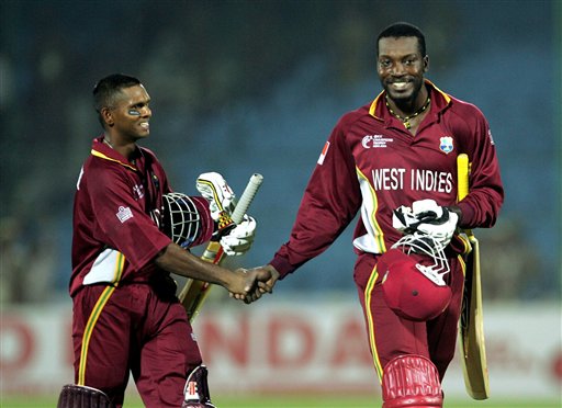 West Indies cricketers Shivnarine Chanderpaul, left, and Chris Gayle, congratulate each other after beating Bangladesh during the one-day international cricket match for the ICC Champions cricket match in Jaipur on Wednesday. ICC CT WI-Bangladesh