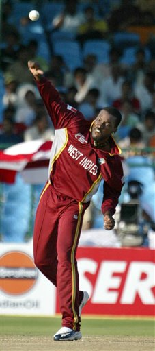West Indies cricketer Chris Gayle bowls during the match against Bangladesh at the ICC Champions Trophy qualifying match in Jaipur on Wednesday. ICC CT WI-Bangladesh