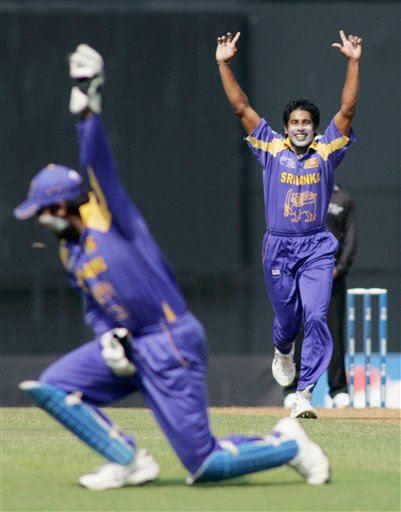 Sri Lankan bowler Chaminda Vaas, right, rejoices along with wicket keeper Kumar Sangakkara after the dismissal of West Indies' Chris Gayle, unseen, during their Champion's Trophy match in Mumbai on Saturday. ICC CT WI-Sri Lanka