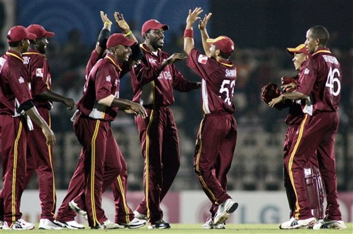 West Indian fielders celebrate the fall of Damien Martyn's wicket as they play against Australia in the one day international cricket match in the ICC Champions Trophy in Mumbai ICC CT WI-Aus