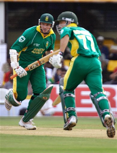 South Africa's captain Graeme Smith, left, and Boeta Dippenaar run between the wickets in their ICC Champions Trophy cricket tournament match against Sri Lanka in Ahmadabad on Tuesday. ICC SA-SL