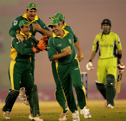South African cricket players celebrate a dismissal of Pakistan's Shoaib Malik, right, during their one-day international cricket match for the ICC Champions Trophy in Mohali on Friday. ICC CT Pak-SA