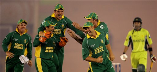 South African cricket players celebrate the dismissal of Pakistan's Shoaib Malik, right, during the one-day international cricket match for the ICC Champions Trophy in Mohali on Friday. ICC CT Pak-SA
