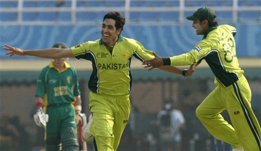 Pakistan's Umar Gul, left, and Muhammad Hafeez celebrate a dismissal of South African Herschelle Gibbs during their one-day international cricket match for the ICC Champions Trophy in Mohali on Friday. ICC CT Pak-SA