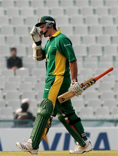 South African cricketer Graeme Smith leaves the ground after Pakistan's Umar Gul took his wicket during the one-day international cricket match for the ICC Champions Trophy in Mohali on Friday. ICC CT Pak-SA
