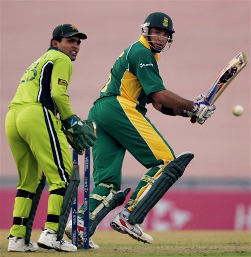 South African cricketer Justin Kemp, right, plays a shot as Pakistan's wicketkeeper Kamran Akmal looks on during the one-day international cricket match against Pakistan for the ICC Champions Trophy in Mohali on Friday. ICC CT Pak-SA