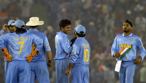 India's bowler Shantakumaran Sreesanth, third right, celebrates with Sachin Tendulkar, (10) and other teammates as Harbhajan Singh, right, joins them after the dismissal of Australia's Adam Gilchrist, useen, during the one day international cricket match for the ICC Champions Trophy in Mohali on Sunday. ICC CT Ind-Aus