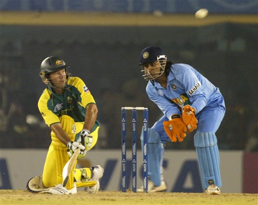 Australia captain Ricky Ponting takes a shot as India's wicket keeper Mahendra Singh Dhoni reacts during the one day international cricket match for the ICC Champions Trophy in Mohali on Sunday. ICC CT Ind-Aus
