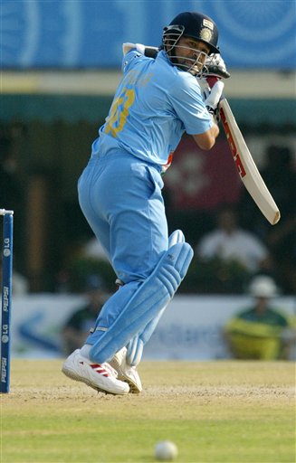 Sachin Tendulkar of India takes a shot off Glenn McGrath of Australia, unseen, during the one day international cricket match for the ICC Champions Trophy in Mohali on Sunday. ICC CT Ind-Aus
