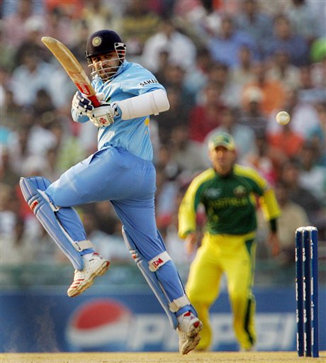 India's Virender Sehwag plays a shot against Australia during the one day international cricket match for the ICC Champions Trophy in Mohali on Sunday. ICC CT Ind-Aus
