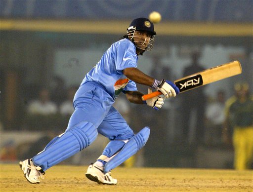 India's Mahendra Singh Dhoni takes run off Australian bowler Nathan Bracken, unseen, during the one day international cricket match for the ICC Champions Trophy in Mohali on Sunday. ICC CT Ind-Aus