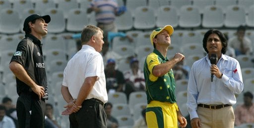 Australian cricket Captain Ricky Ponting, second right, tosses a coin as his New Zealand counterpart Stephen Fleming, left, match referee Mike Prokter, second left, and TV anchor Ramiz Raja look on prior to the one-day international cricket match between New Zealand and Australia for the ICC Champions Trophy in Mohali ICC CT NZ-Aus